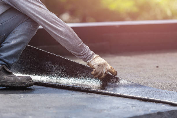 Professional Basement Waterproofing technician working in Charlotte, MI